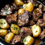 crockpot garlic butter beef bites with potatoes
